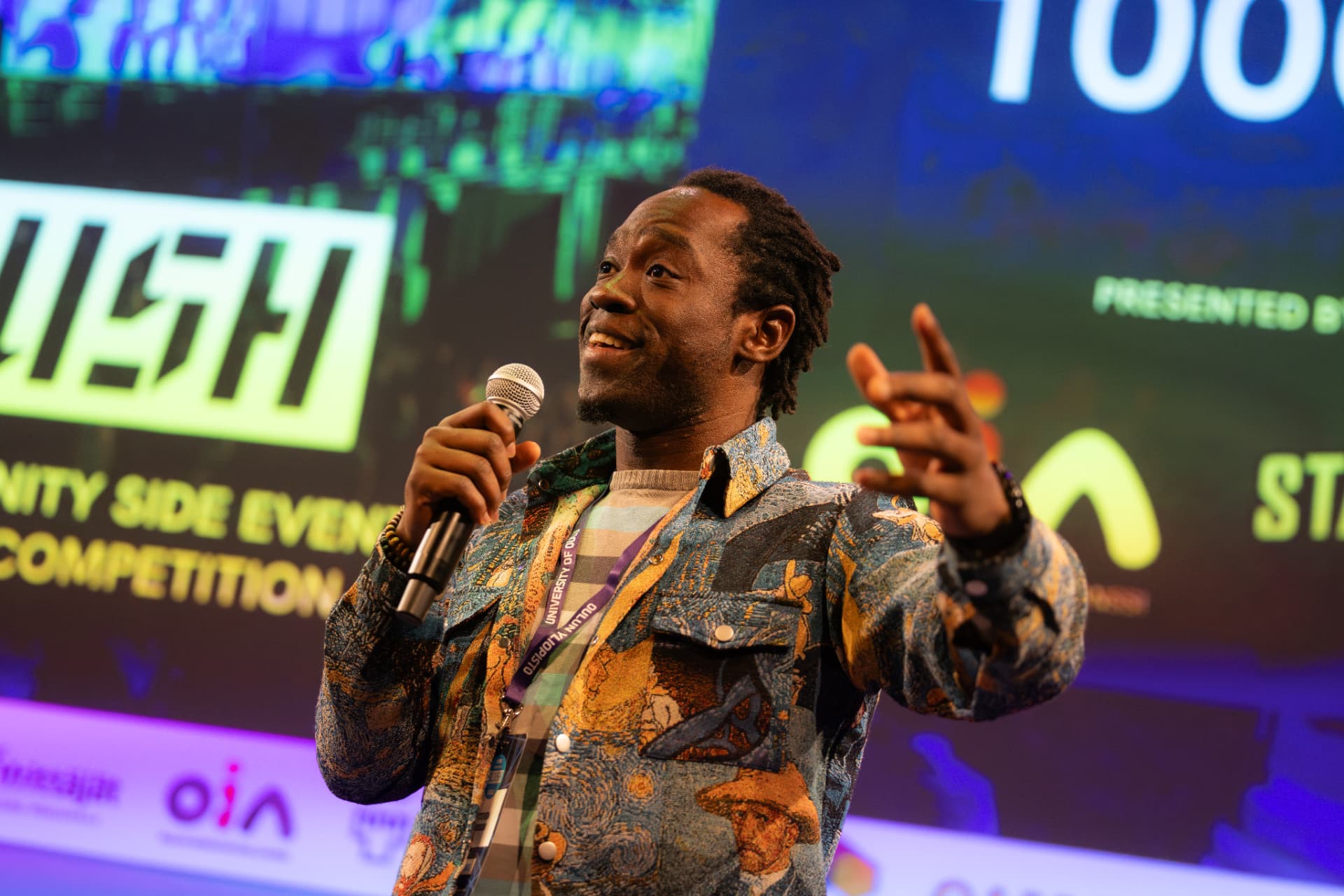 Steven Dossou delivering a keynote